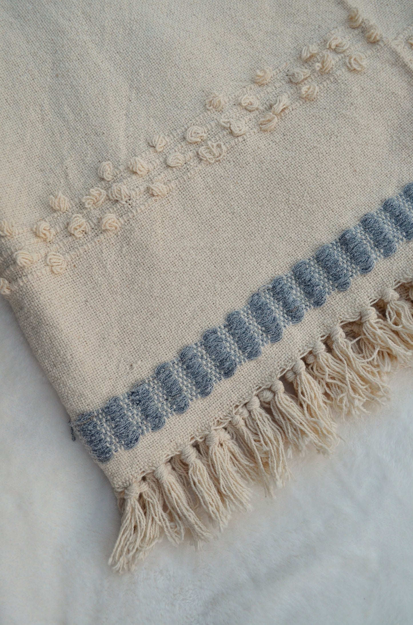 Beige and duck egg blue tufted throw